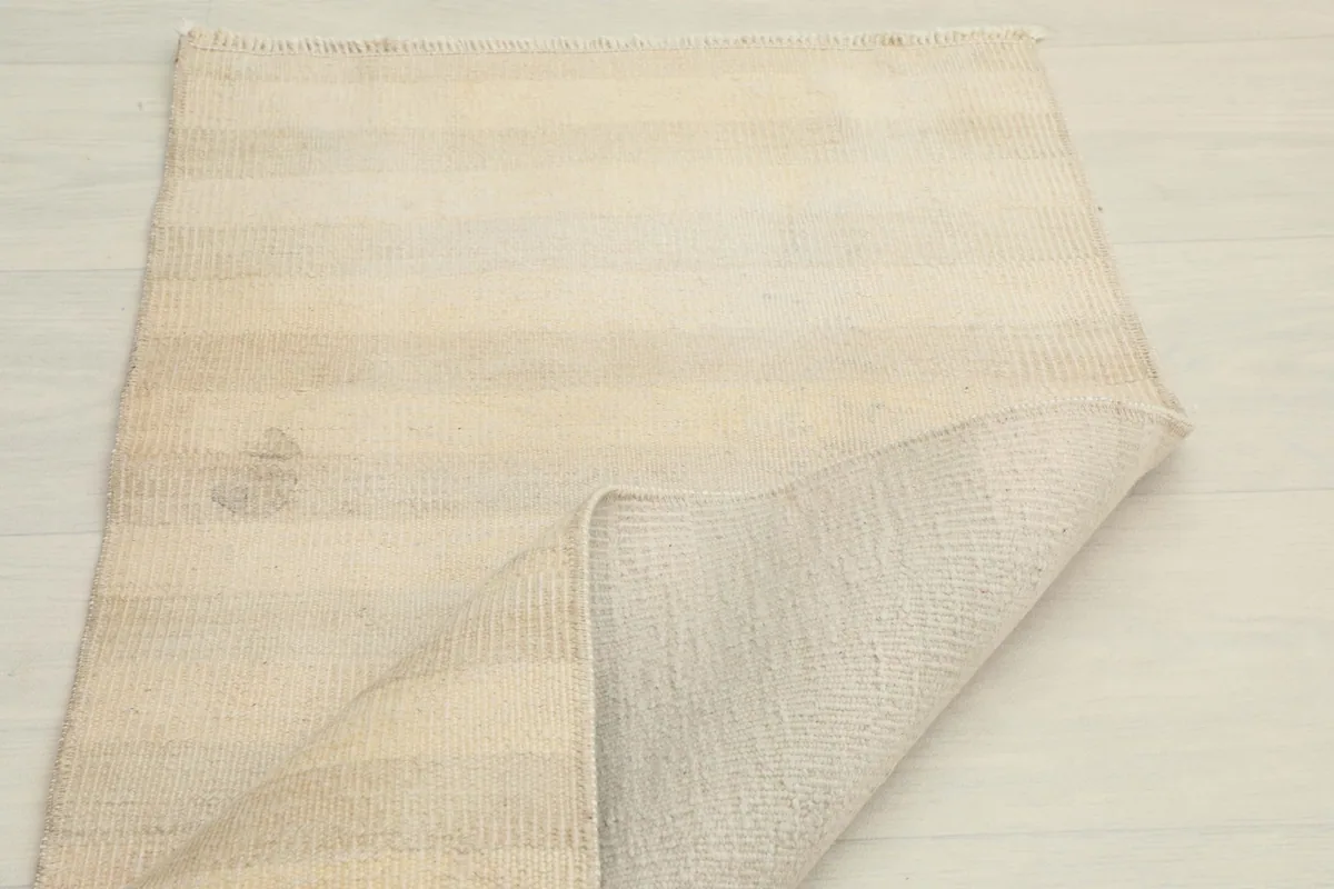 Another folded view, revealing the back of the rug and the consistent weave.