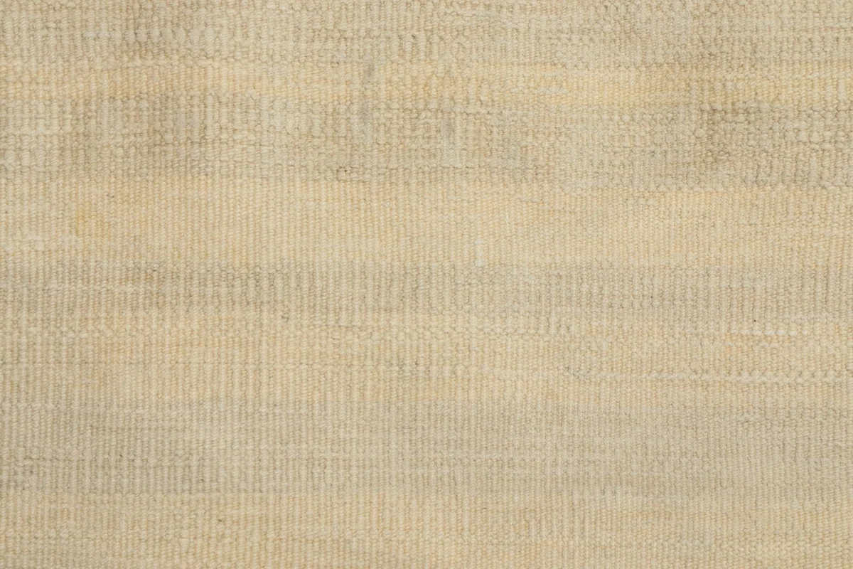 Tight detail of the wool pile showing the subtle tonal beige and ivory stripes.
