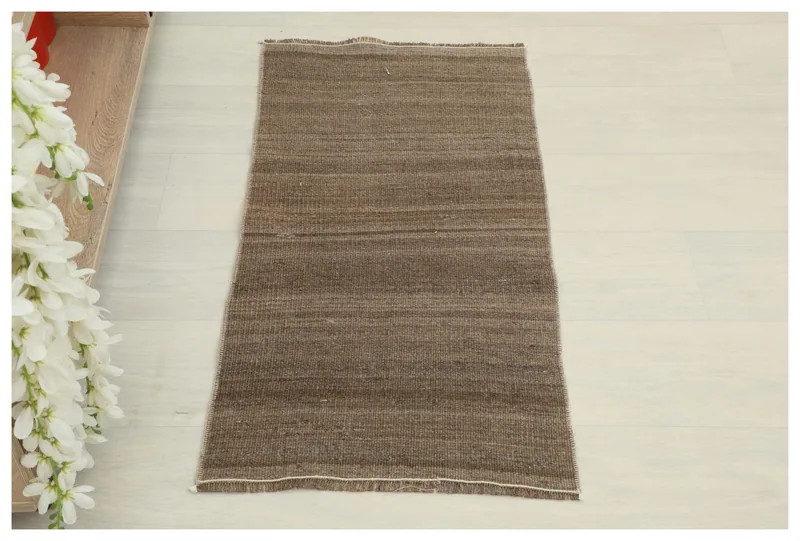 Full top view of the 1'5" x 2'9" brown striped vintage doormat on a white background.