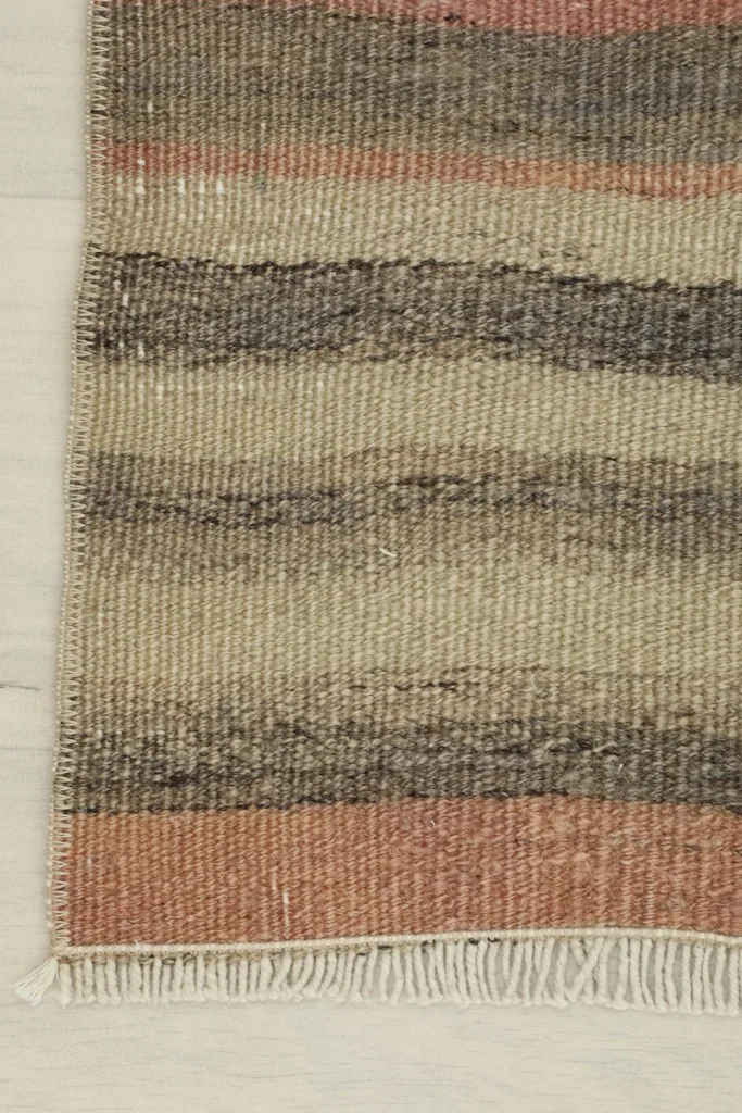 Corner detail of the doormat, showing the finished edge and fringe.