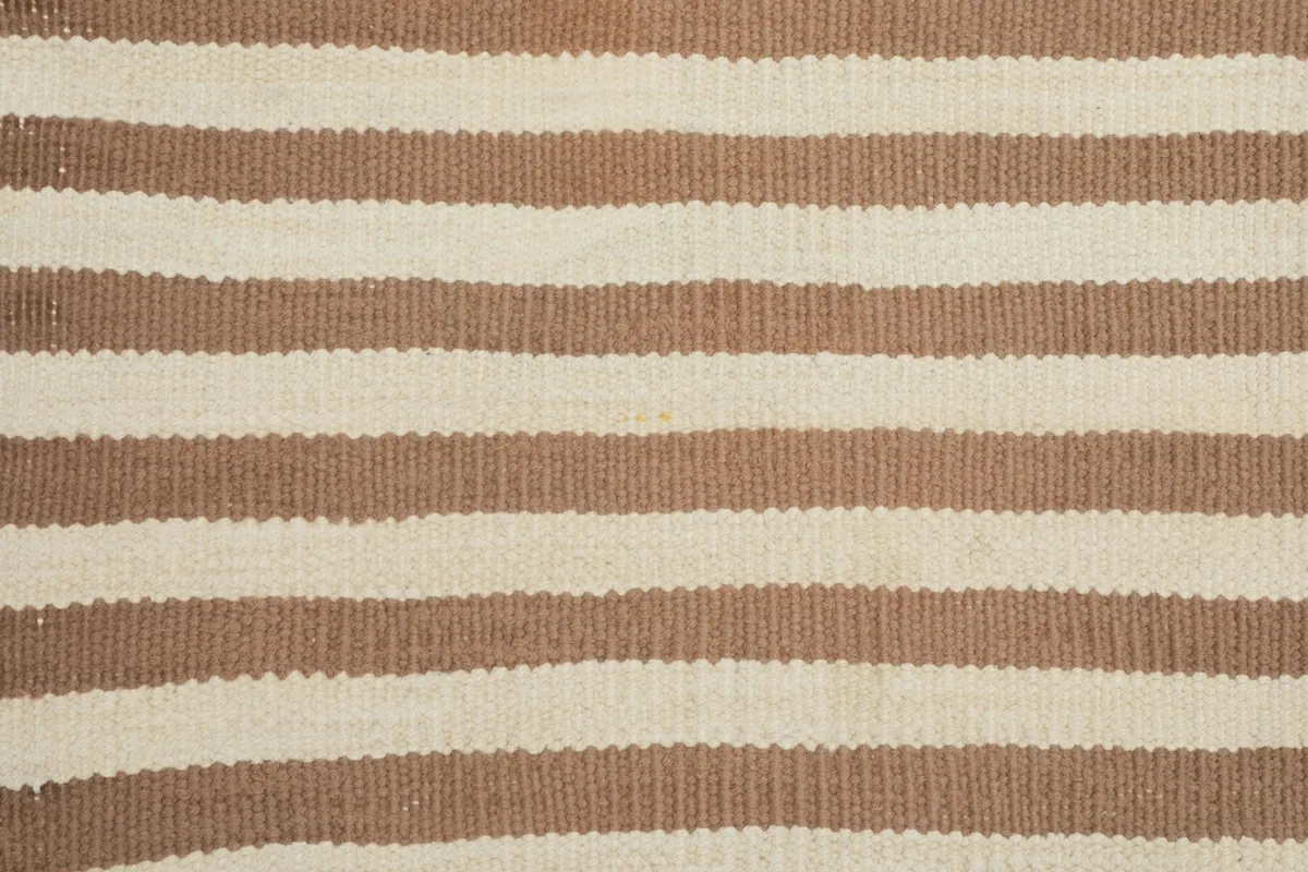 Detailed close-up of the low wool pile and hand-knotted texture
