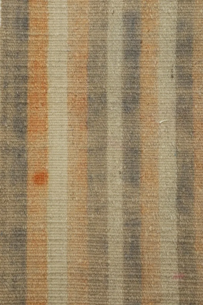 Detailed close-up of the varied striped pattern, showing individual knots and color variations.