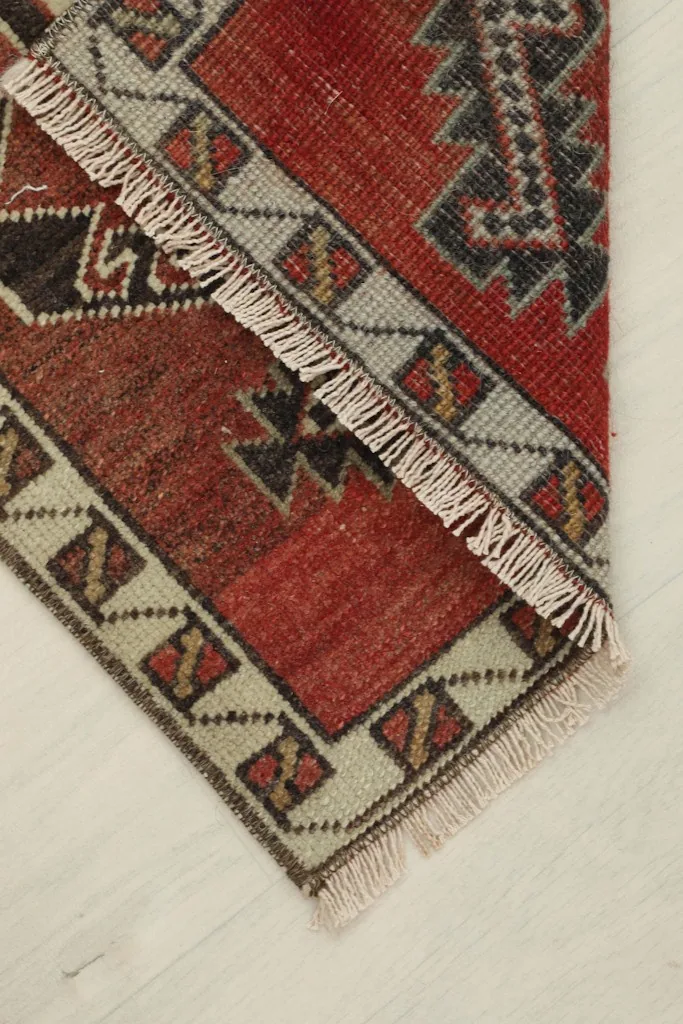 The rug folded to show the flexibility and thickness of the hand-knotted material