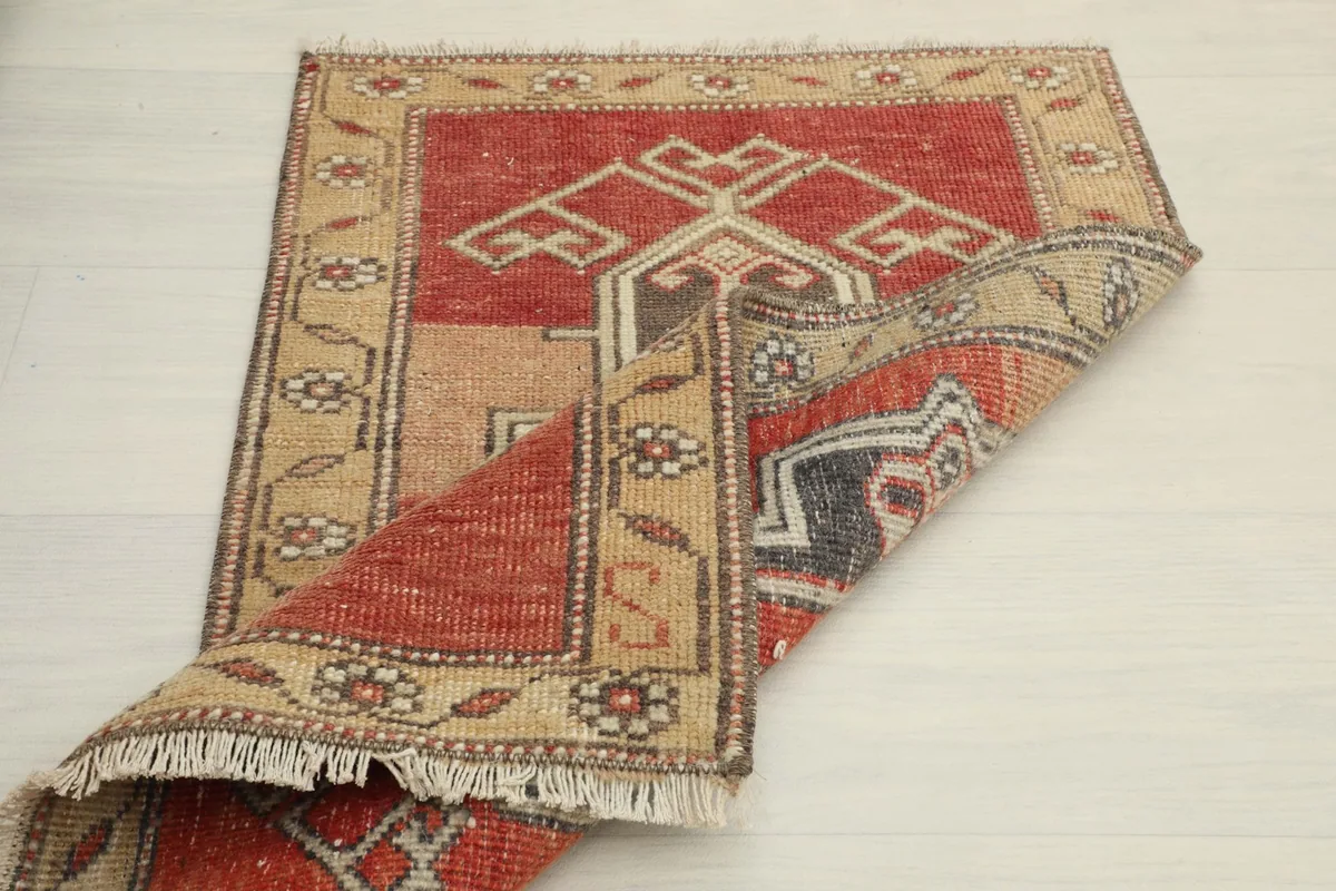 Rug folded to display the full pattern and the reverse side
