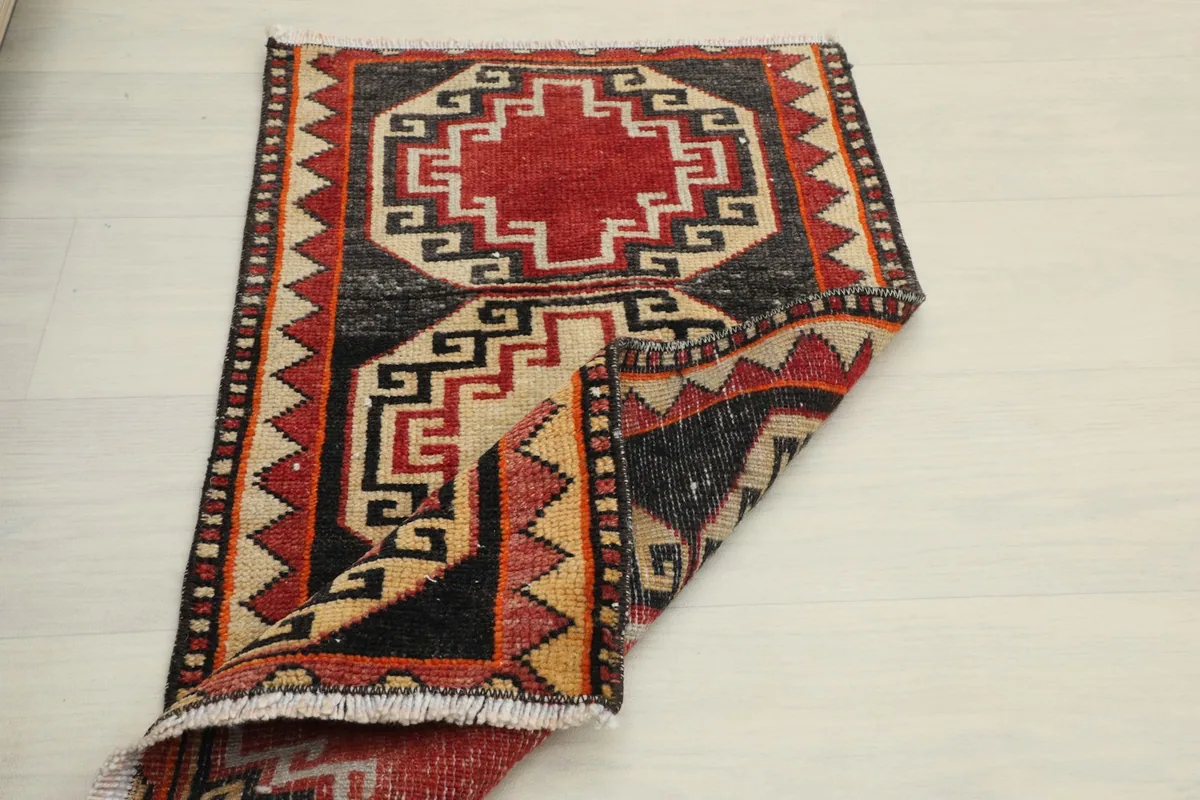 Full view of the rug with one corner folded back, showing the thickness and texture.
