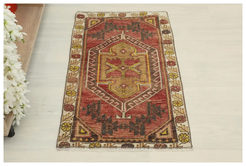 Full overhead view of the Red Gold Geometric Anatolian Rug on a white background.