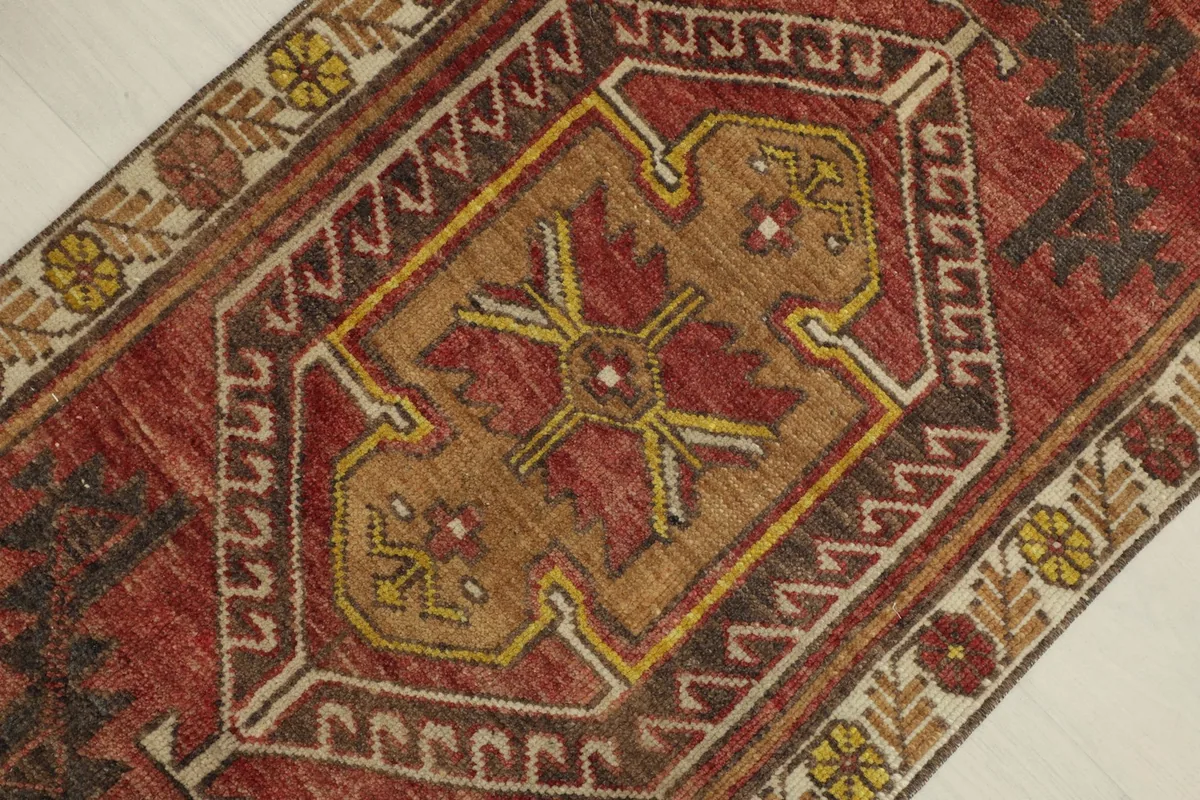 Detailed view of the central gold medallion with red and yellow accents.