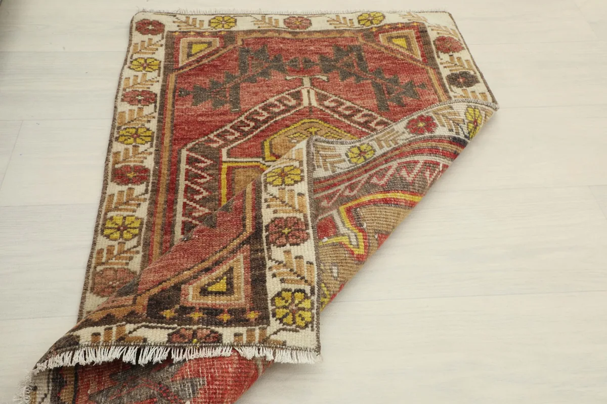 Another view of the rug folded, demonstrating its pliable nature and overall design.