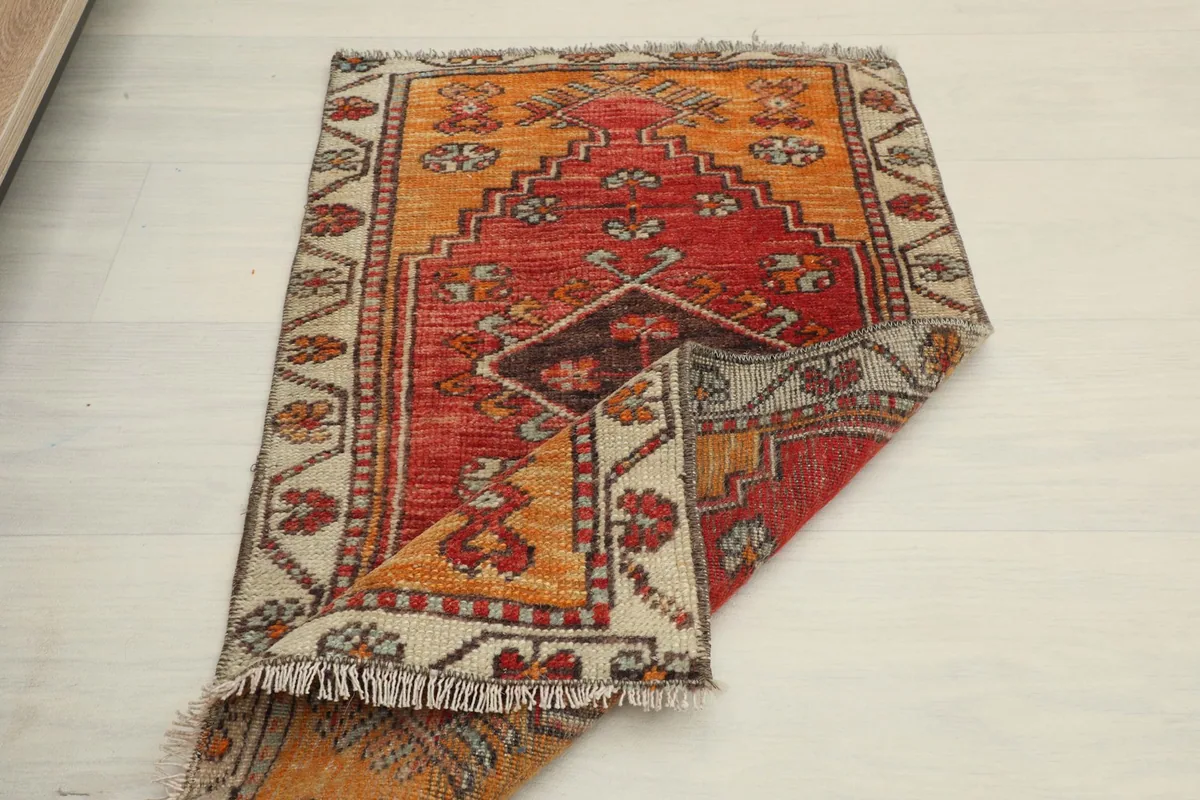 Partial fold of the rug, displaying the top surface and texture