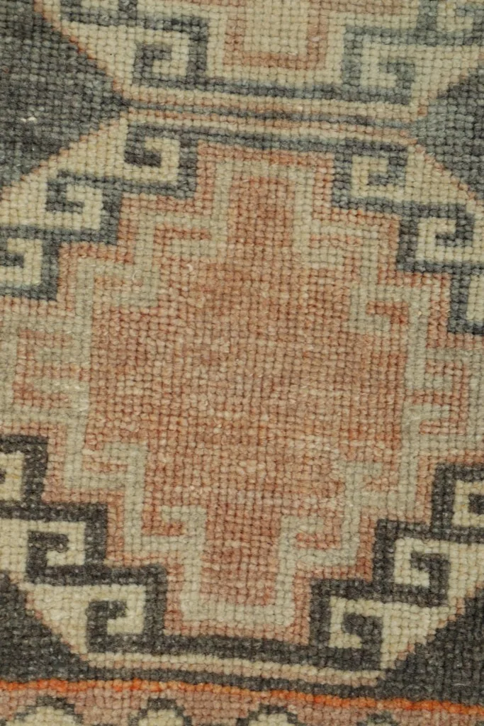 Close-up of the low wool pile, revealing the natural texture and color variations