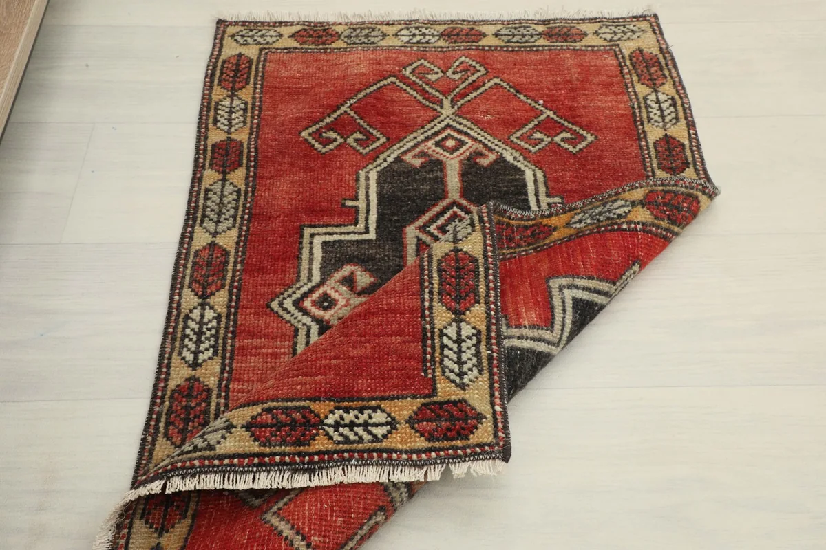 The rug partially folded, illustrating its flexibility and thickness.