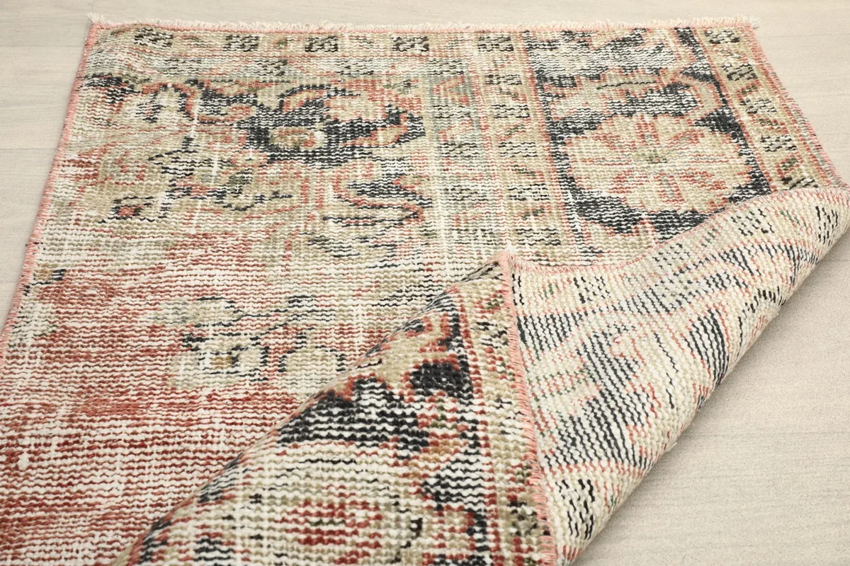 The rug folded to show the flexibility and thickness of the hand-knotted material.
