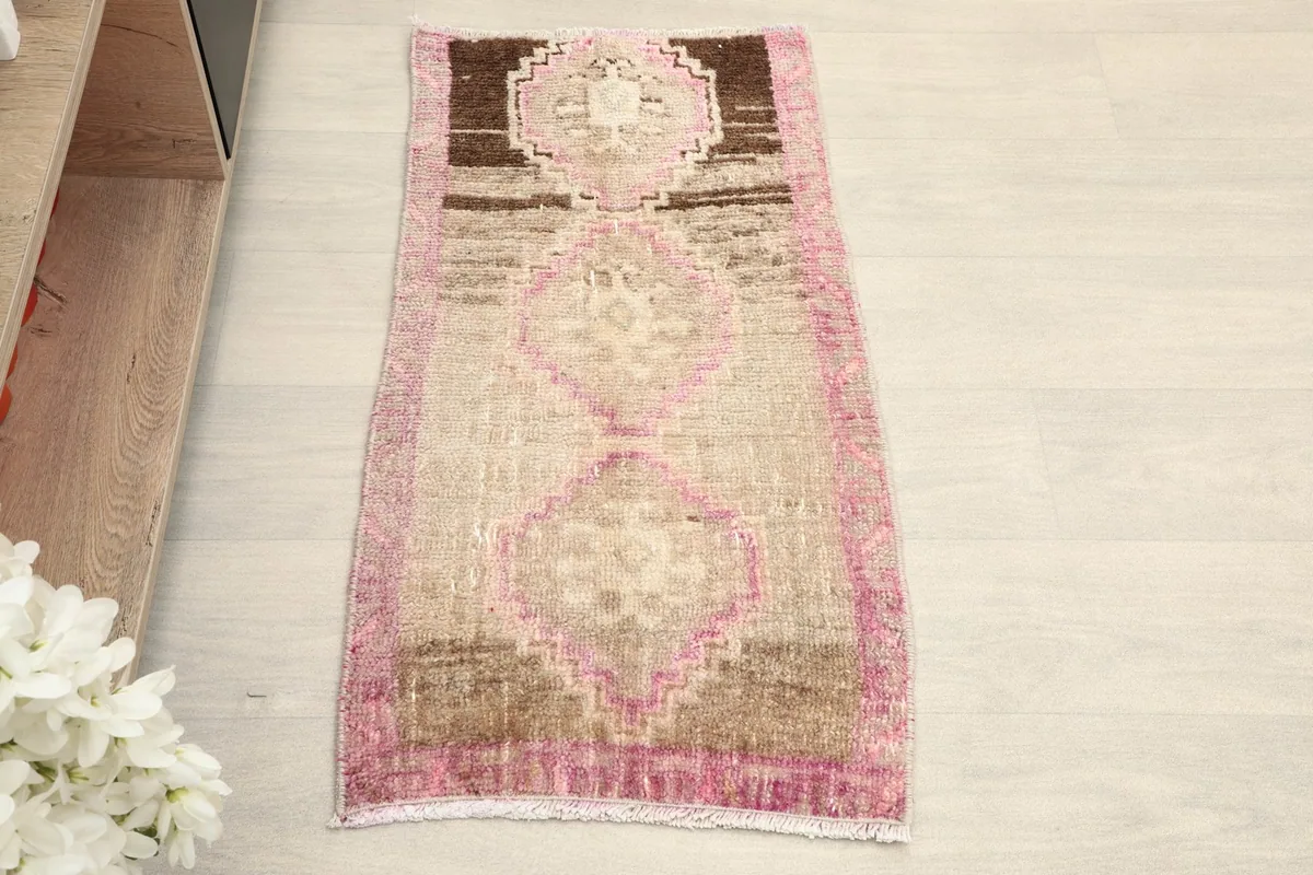 Overhead view of the hand-knotted wool rug, showing its full design and colors