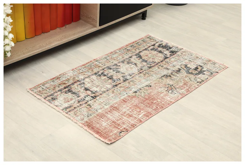 Full top view of the 1'10" x 3'2" vintage Anatolian rug with rust, black, and beige colors