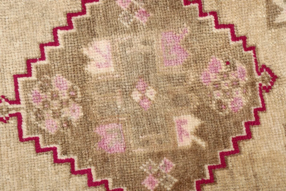 Detailed view highlighting the texture and colors of the vintage wool pile and knotting.