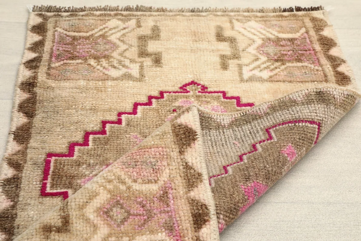 The rug folded to show its flexibility and thickness of the wool pile.