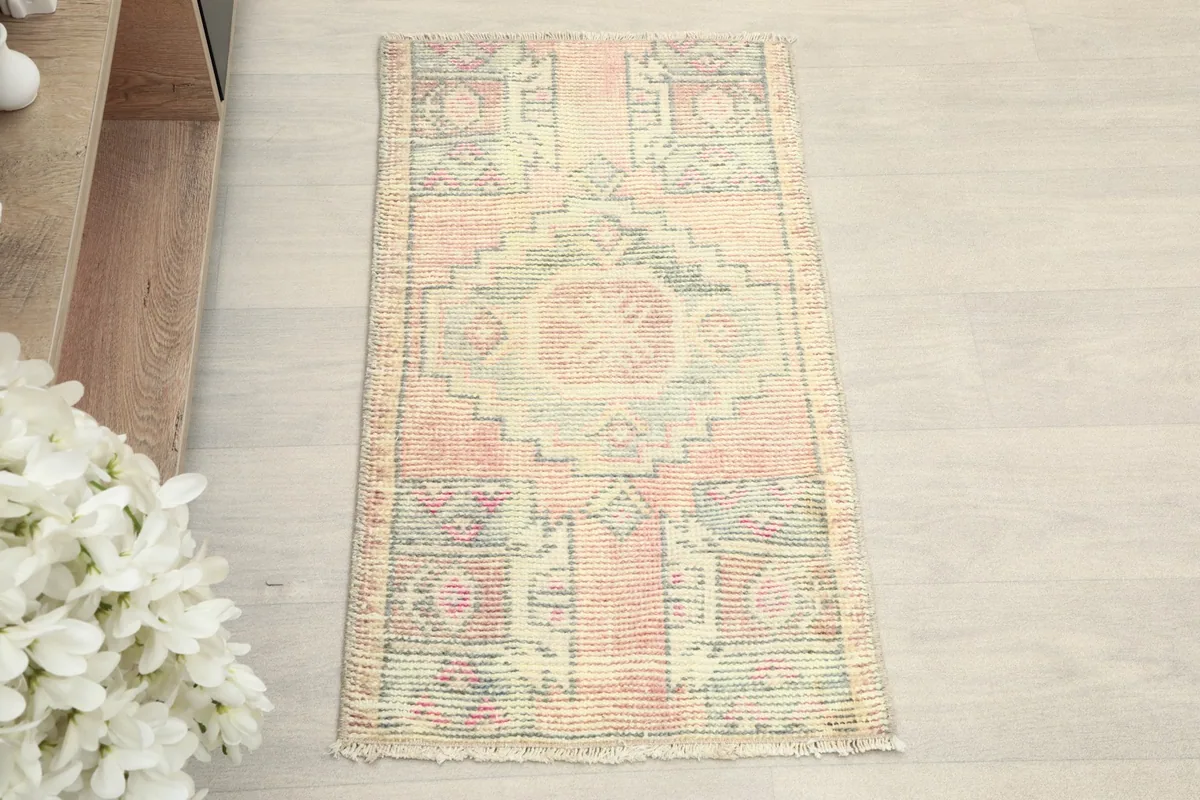 Overhead view showcasing the full design and colors of the hand-knotted wool rug