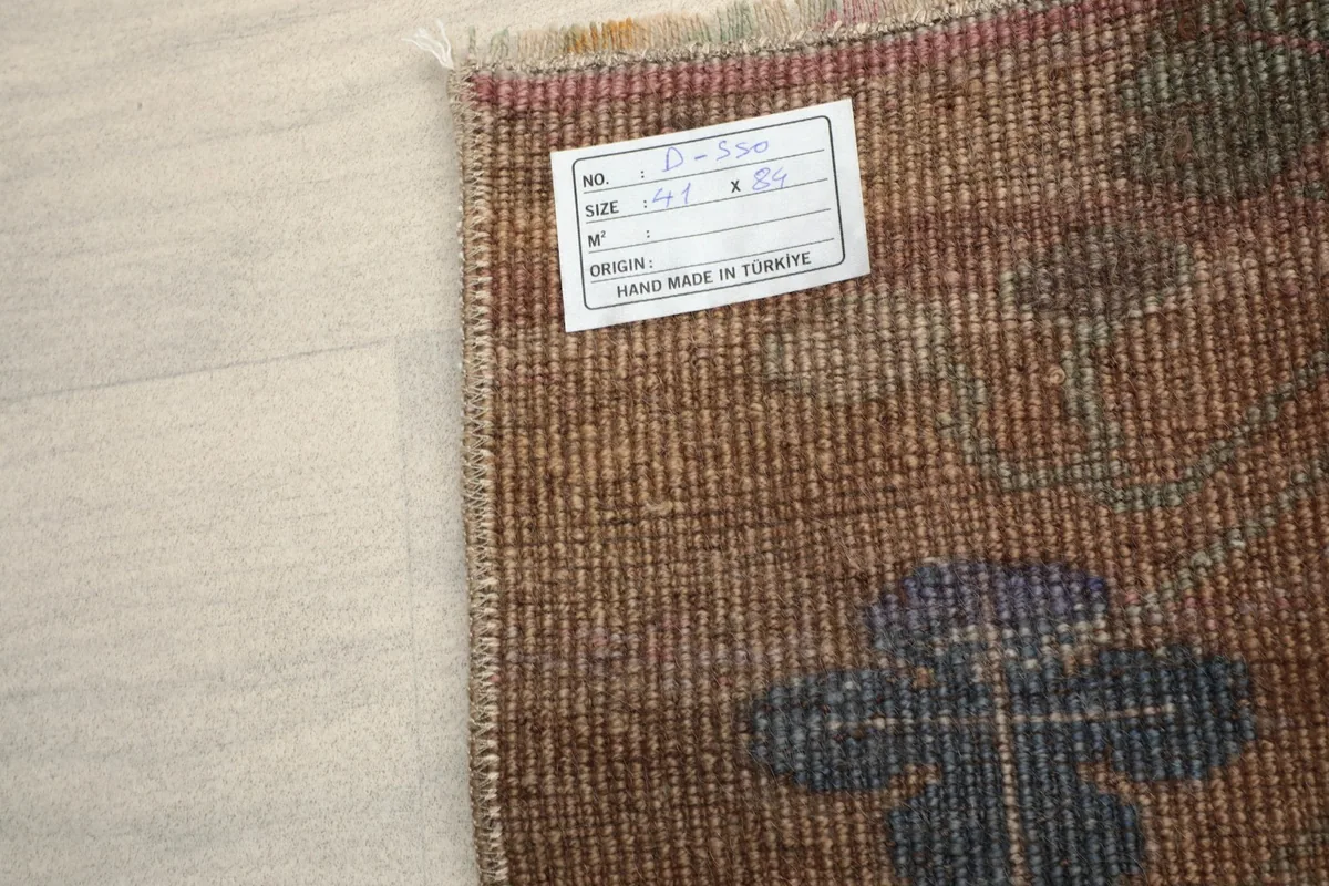Back of the rug, displaying the tightly woven cotton foundation and hand-knotted structure.