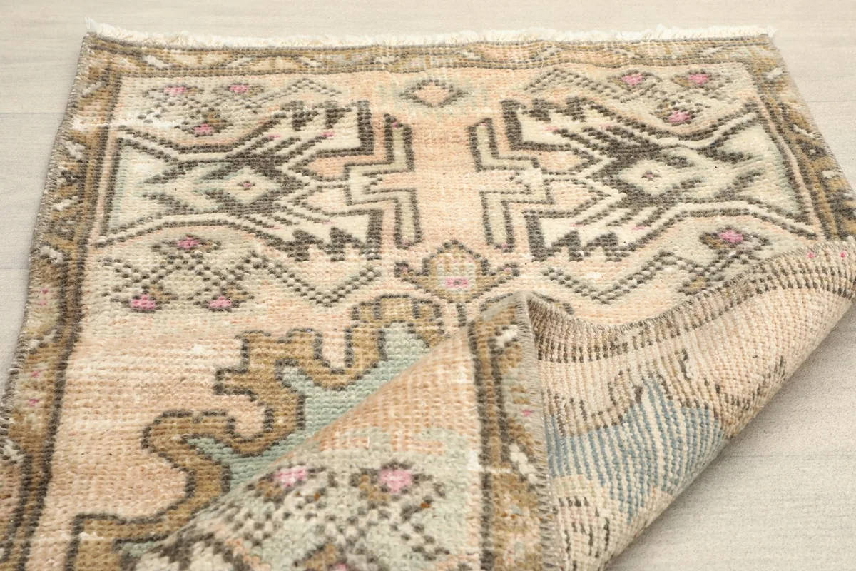 Another folded view, displaying the reverse side of the rug and the construction.