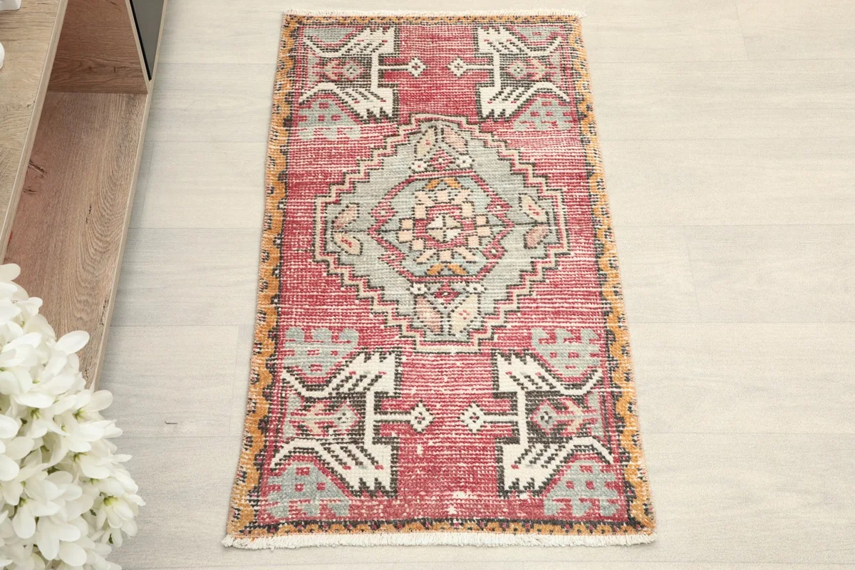 Overhead view of the hand-knotted rug, showing its rectangular shape and central medallion design.