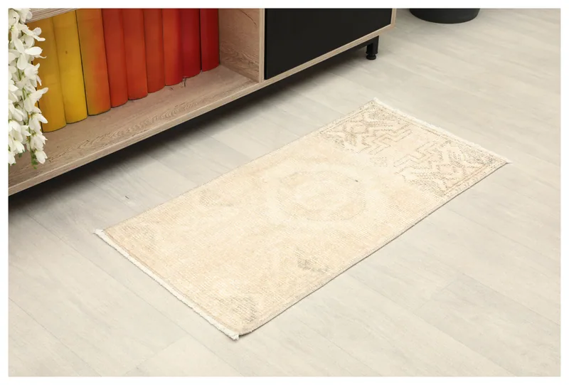 Full top view of the 1'5" x 2'10" beige and gray geometric Anatolian doormat