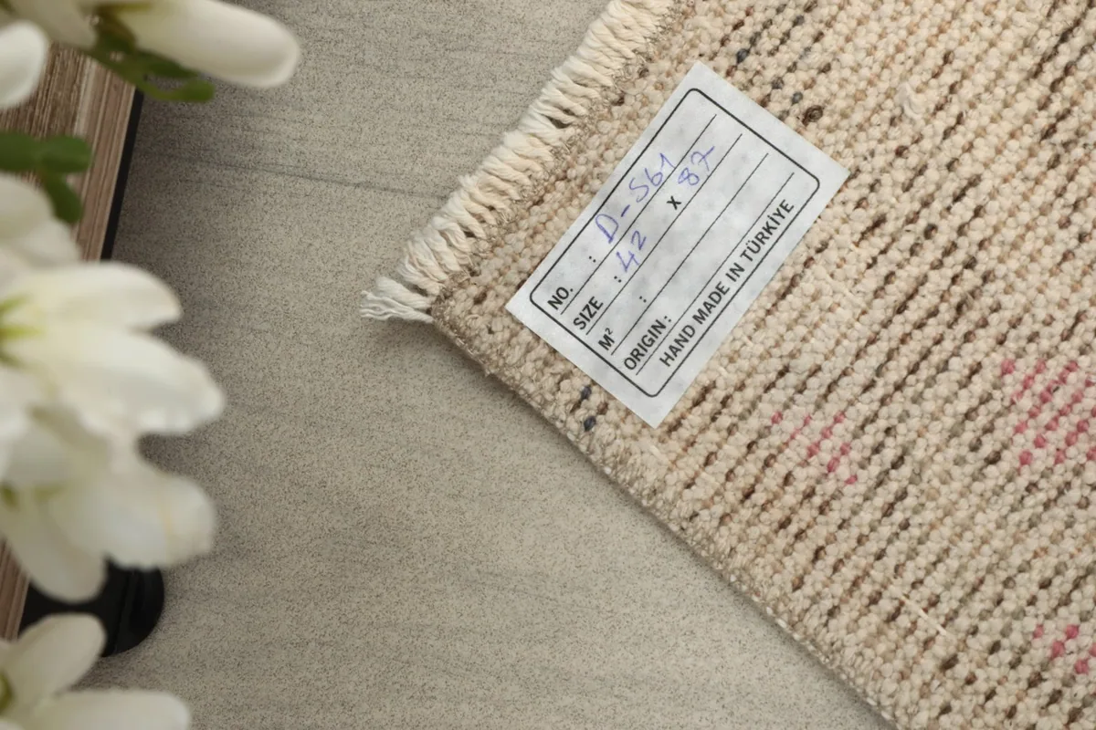 Close-up of the rug's label, confirming its origin from Anatolia, Turkey and dimensions