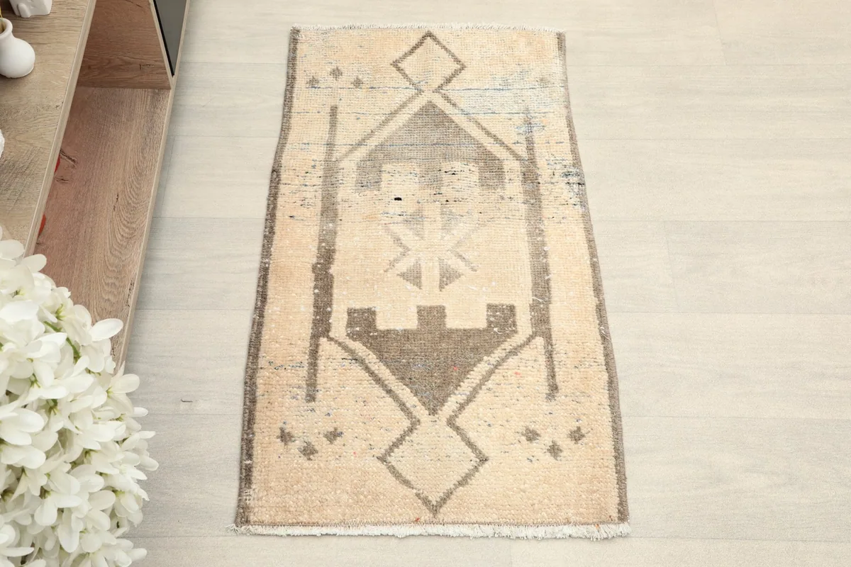 Overhead view of the doormat, highlighting its geometric tribal design and colors.