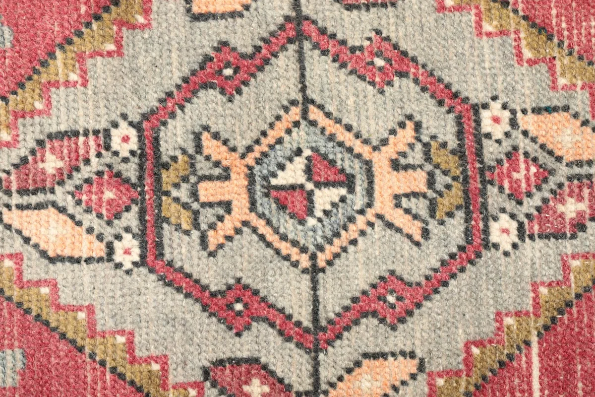 Detailed view of the central medallion's intricate geometric patterns and color variations.