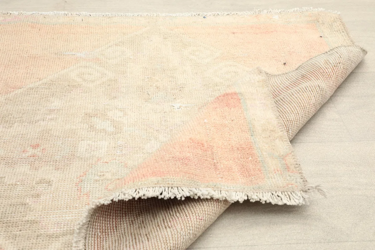 Underside of the hand-knotted rug revealing the cotton foundation and tight weave