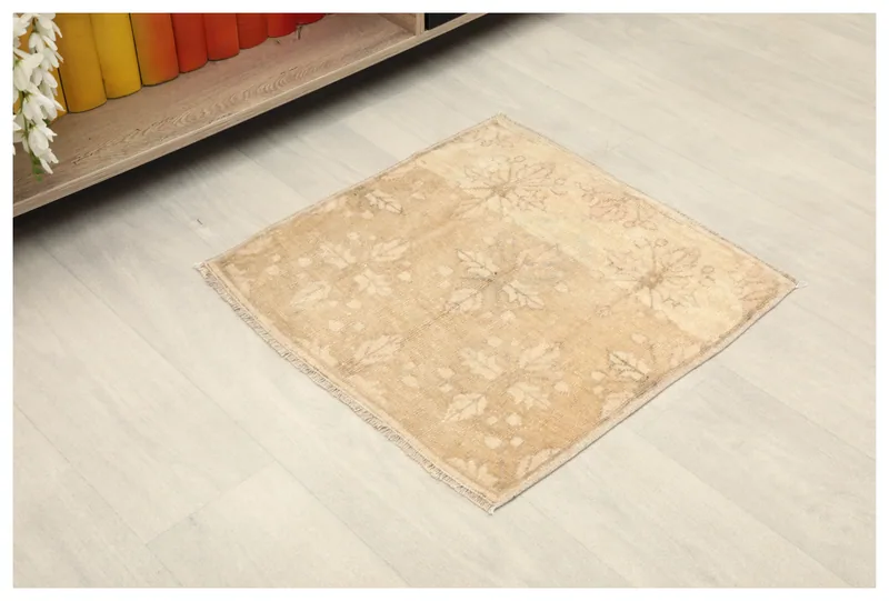 Full top view of the 1'11" x 1'11" beige Anatolian doormat rug on a white background.