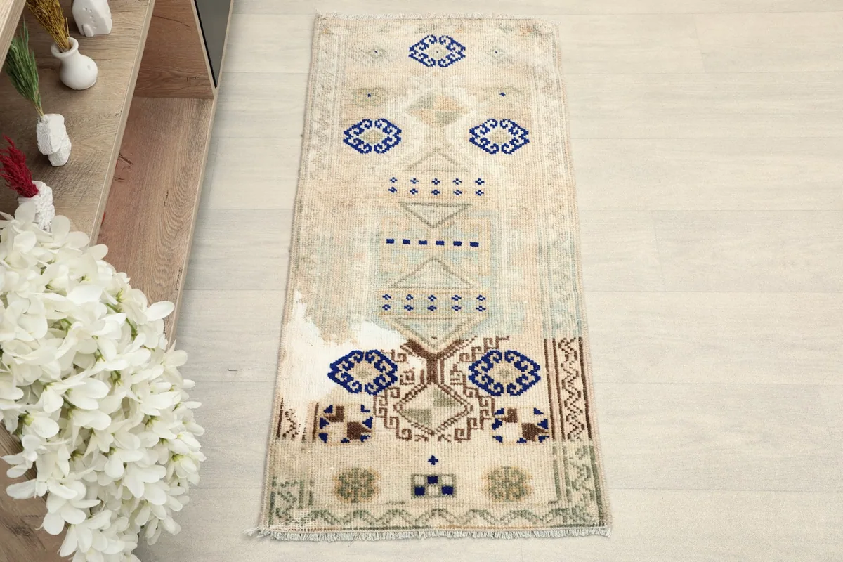 Overhead view of the vintage Anatolian doormat, showcasing its full design.