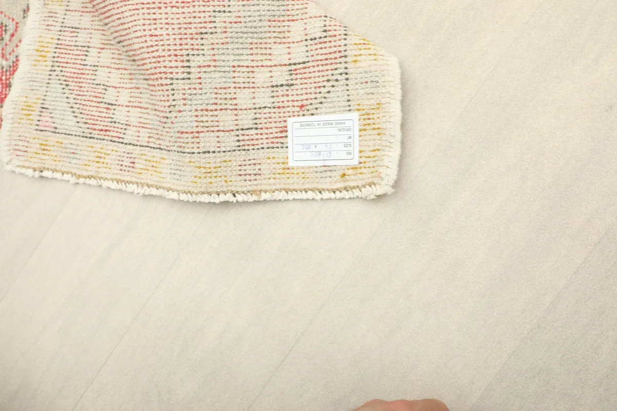 Back of the hand-knotted rug revealing the cotton foundation and knotting