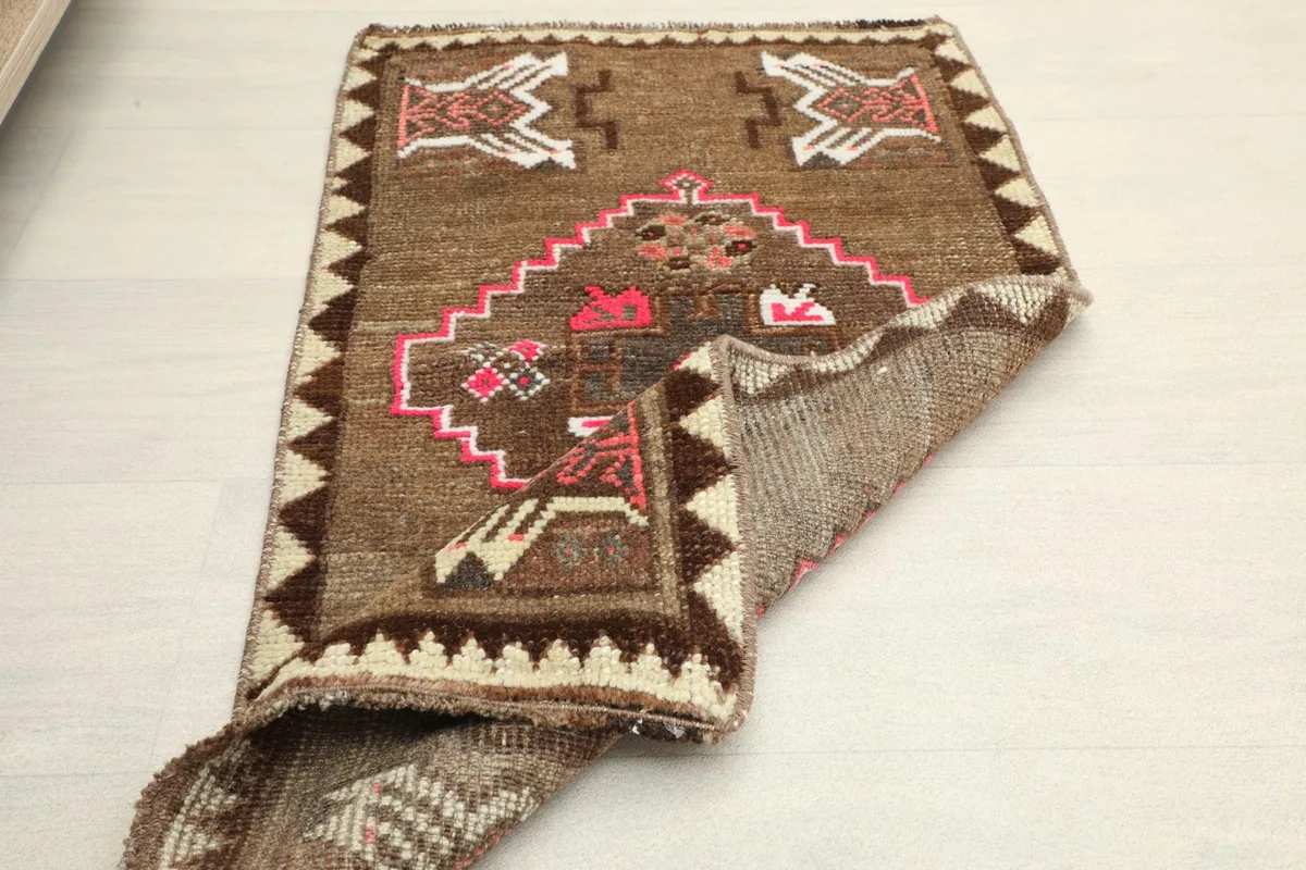 Rug partially folded, suggesting its size and how it might look in a small room setting
