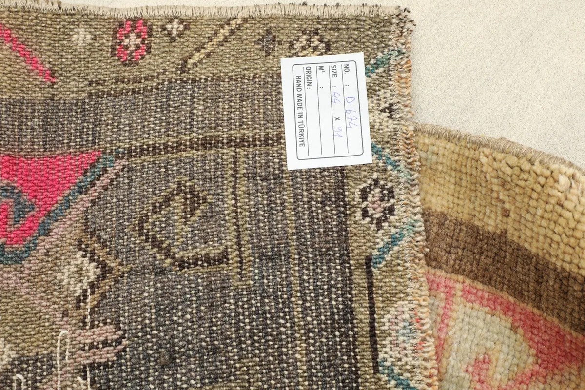 Reverse side of the Anatolian rug, revealing the intricate hand-knotted work and wool on cotton foundation.