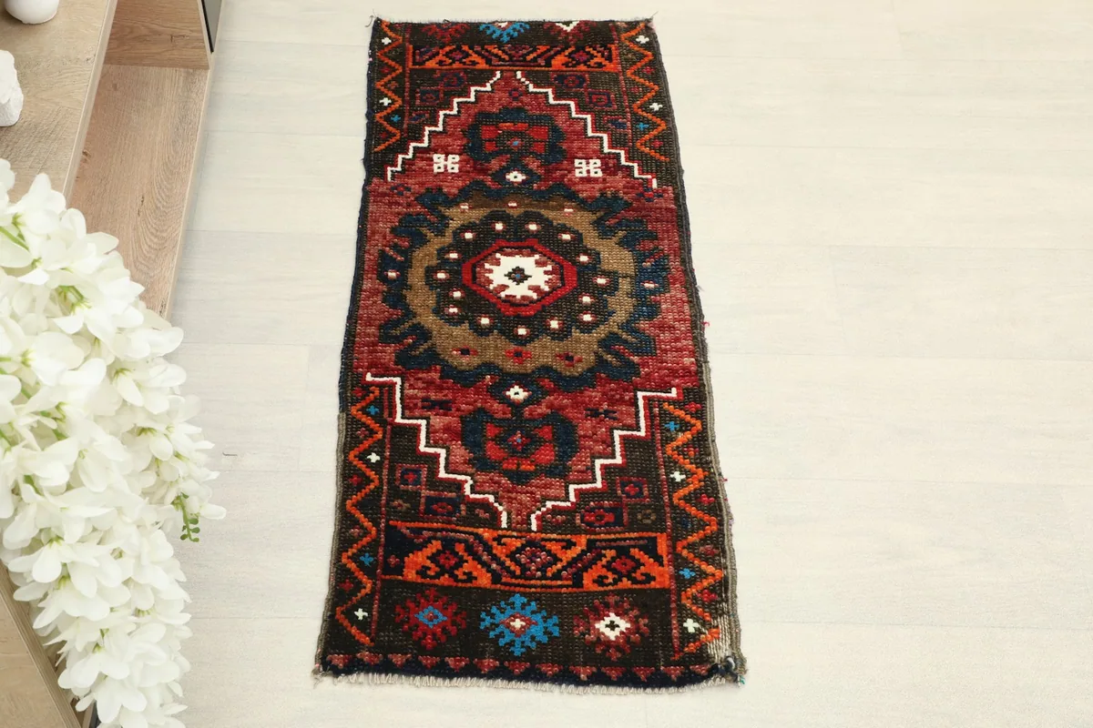 Overhead view of the hand-knotted wool rug, showing its tribal patterns