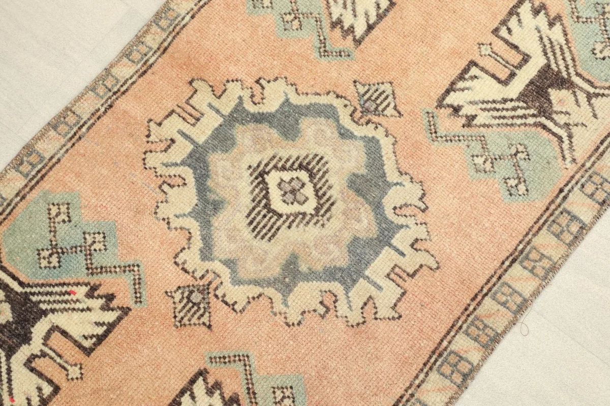Close-up detail of the central gray medallion and surrounding tribal patterns