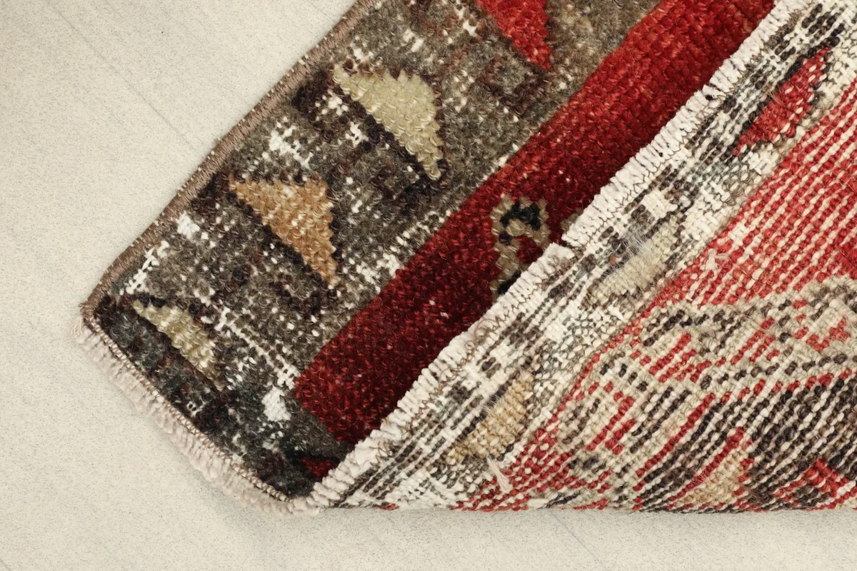 View showing the low wool pile and the texture of the hand-knotted vintage rug.
