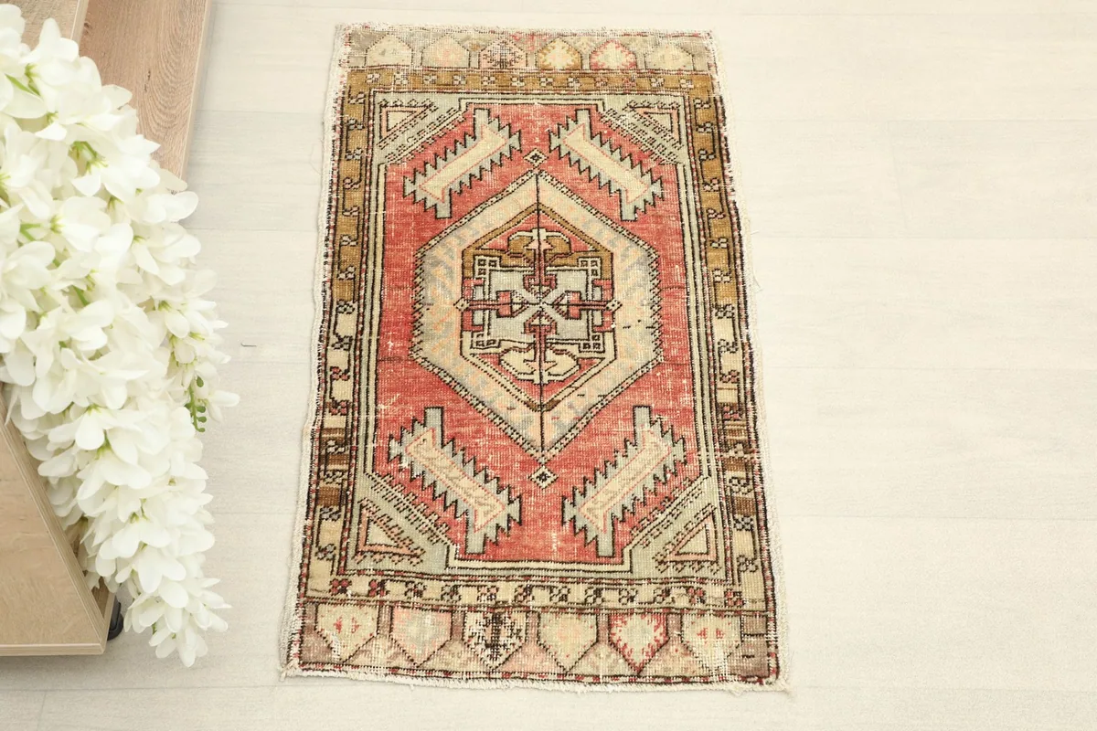 Overhead view of the 1x3 vintage rug, showing its full design and color variation.