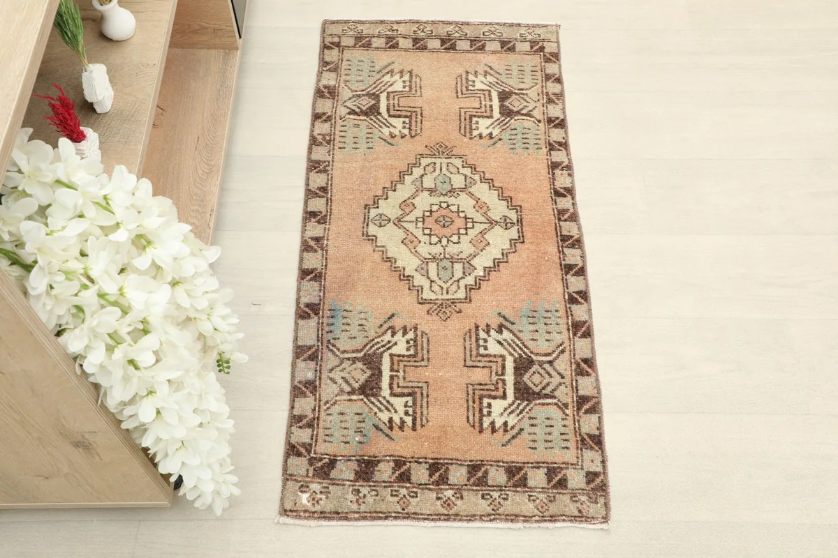 Overhead view of the hand-knotted rug, showing its rectangular shape and overall pattern.