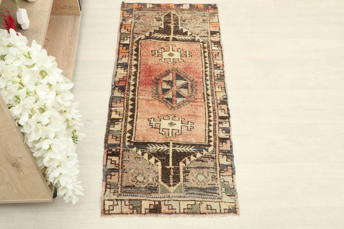 Overhead view of the hand-knotted rug, highlighting its full length and traditional design.