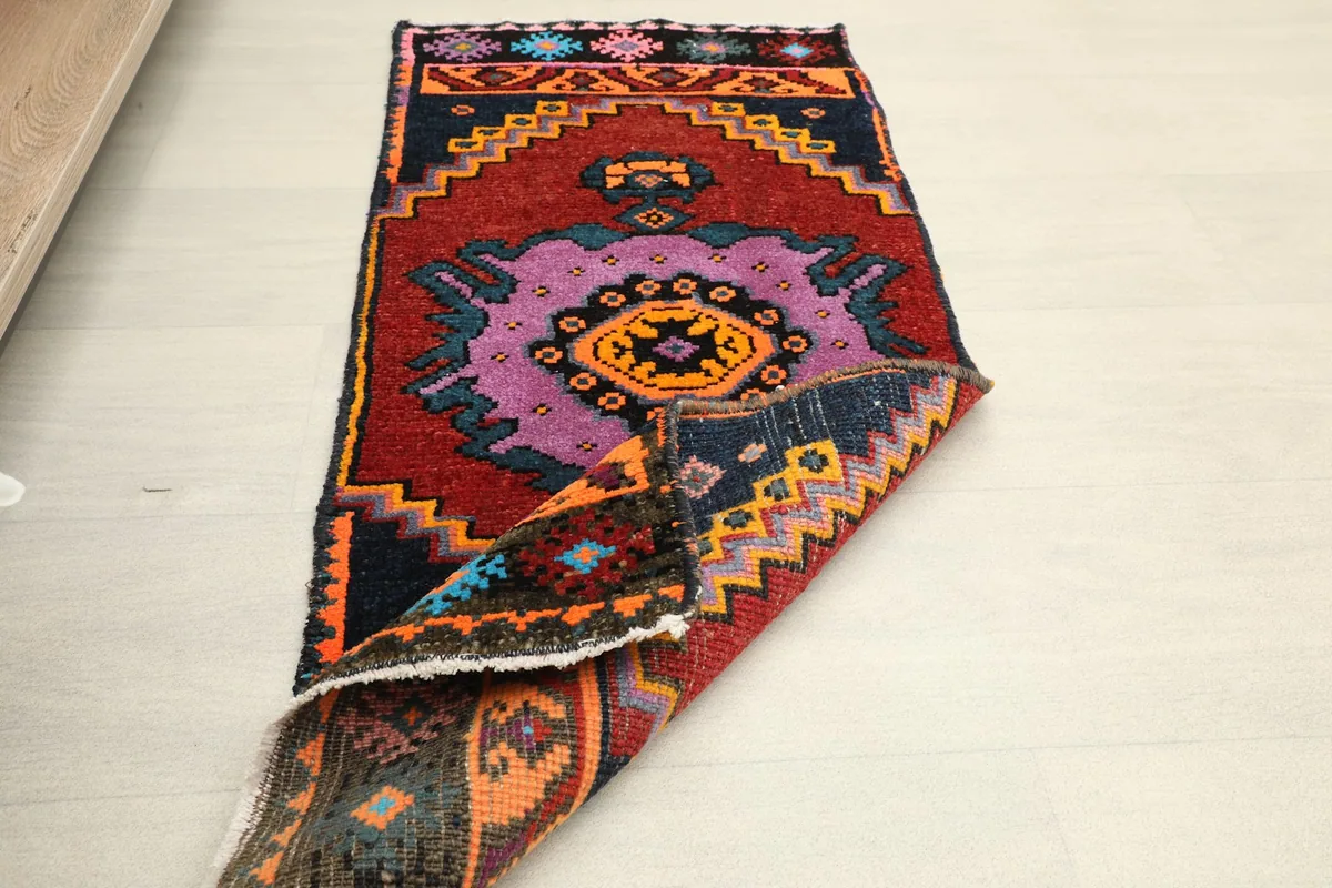 Partially folded runner, displaying the full design and flexibility of the vintage textile.