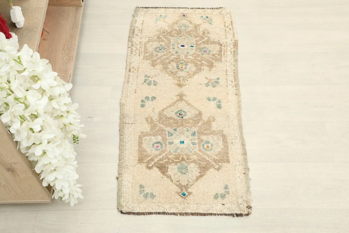 Overhead shot of the small hand-knotted wool rug, showing its full rectangular shape and design