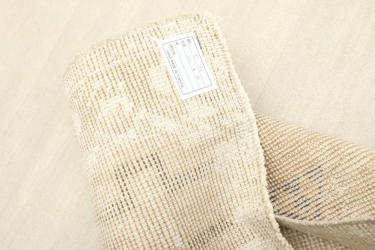 View of the back of the vintage Anatolian rug, displaying the tight hand-knotted weave and foundation.