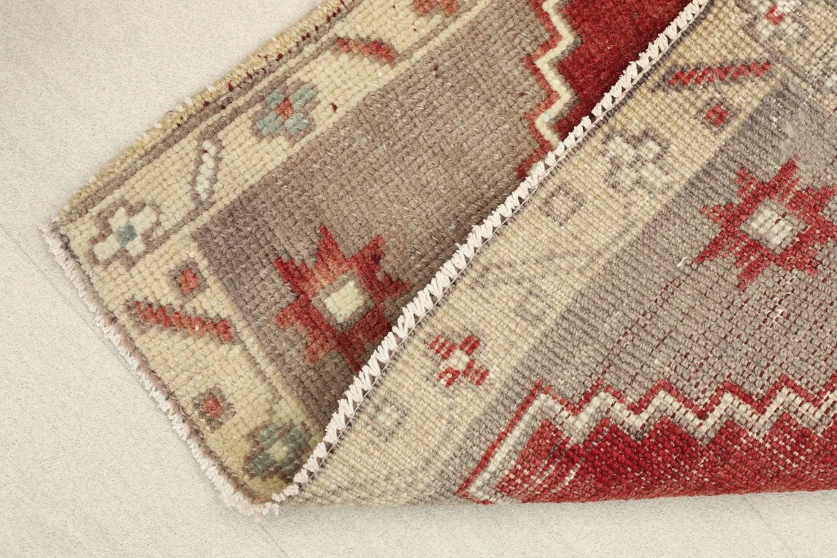 View of the rug folded to show its flexibility and thickness