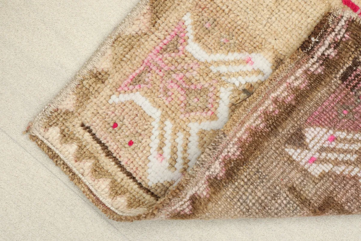 Folded view of the rug, illustrating the flexibility and texture of the wool