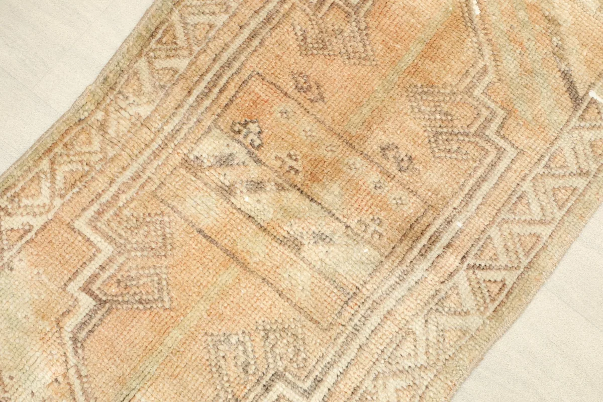 Angled view highlighting the texture and color variations of the hand-knotted wool pile