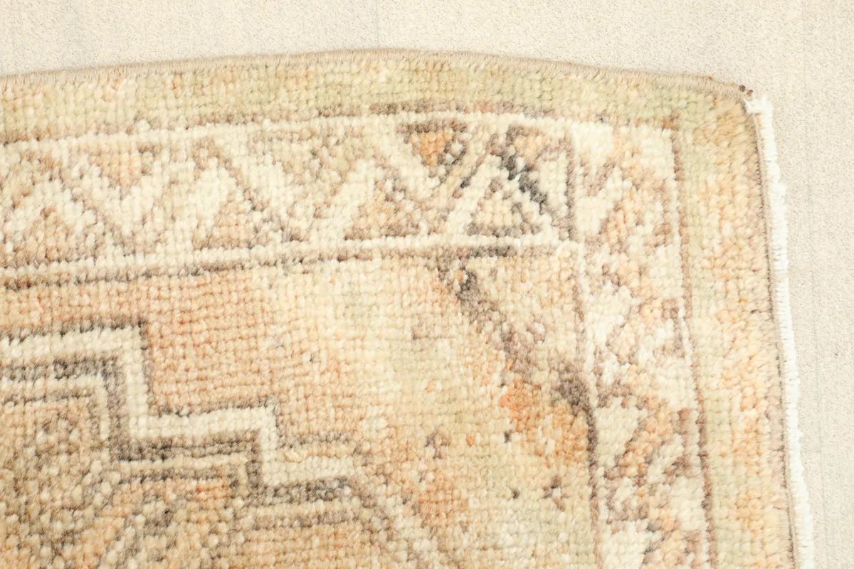 Close-up of the low pile and intricate knotting, revealing the vintage character