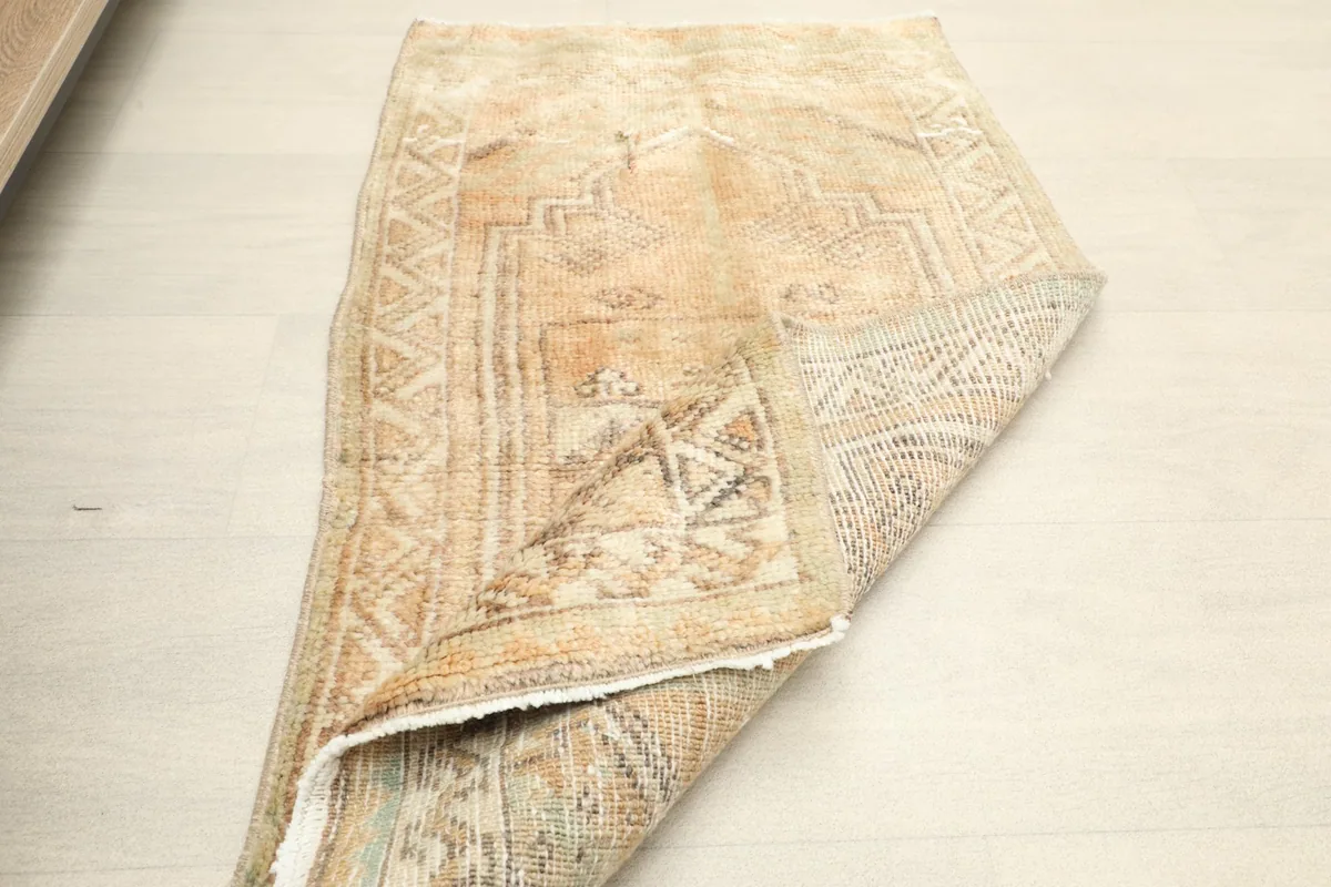 The rug folded to show its flexibility and the consistent design from a different perspective