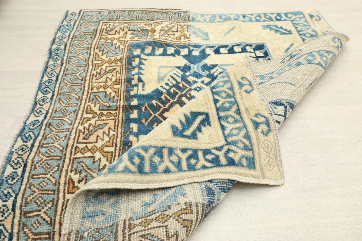 Folded view of the runner rug, showcasing the overall design and flexibility of the weave