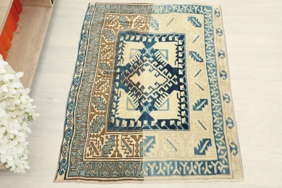 Overhead view of the ivory and blue tribal runner rug, highlighting its geometric patterns
